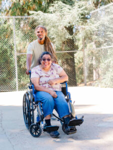 volunteer and ICAN client having a great time at summer camp