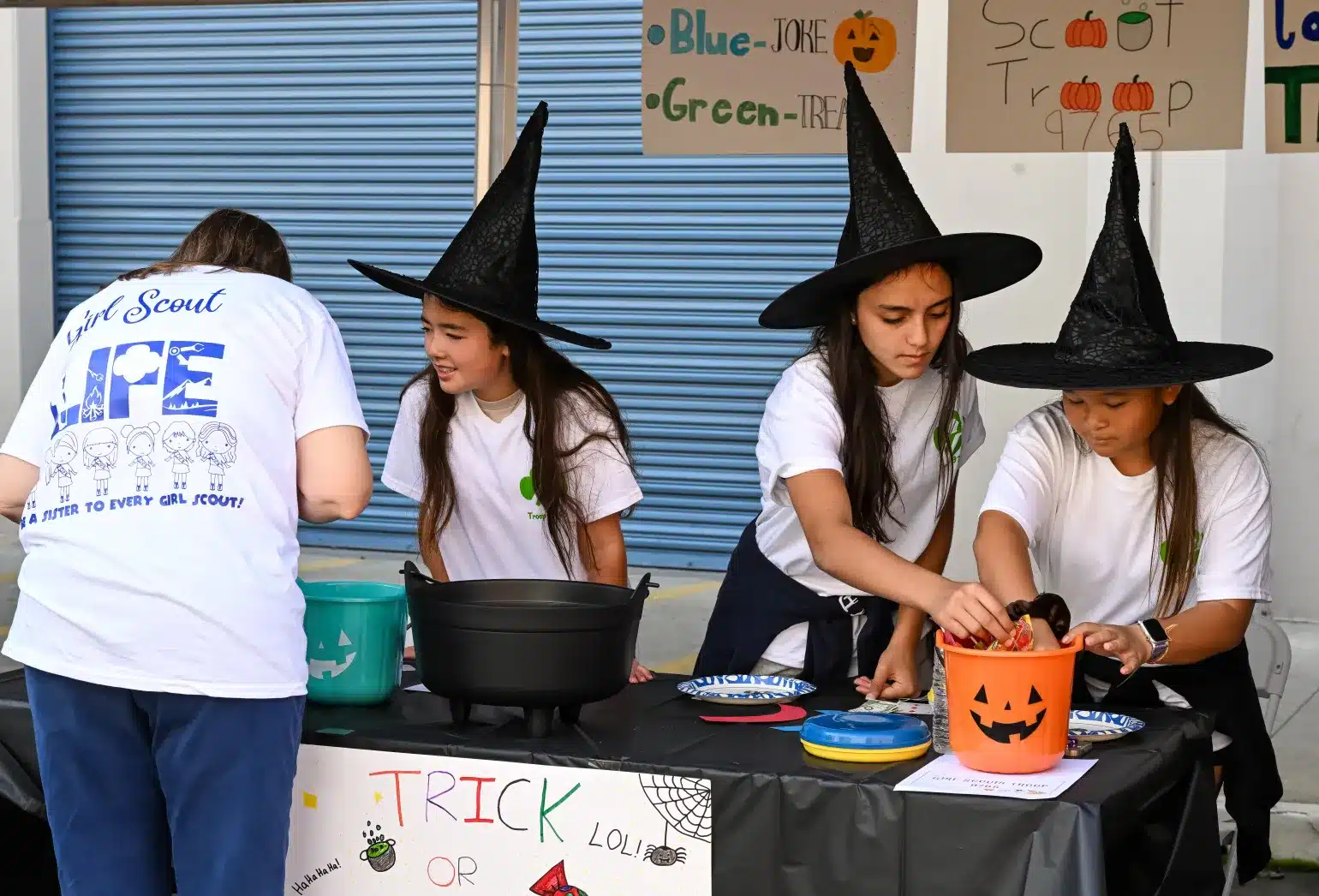 Witch volunteers at halloween party