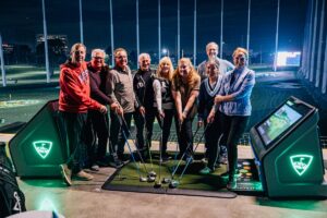 Golfers at ICAN Fundraiser at TopGolf
